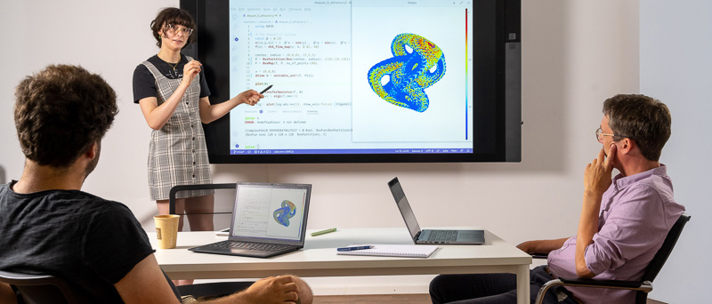 A group of researchers is discussing the computation and representation of an attractor, a set containing all the states of a time-varying system that are actually assumed over time.